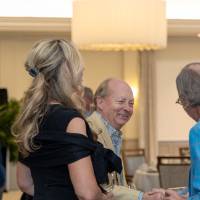 Two gentlemen shaking hands at event
